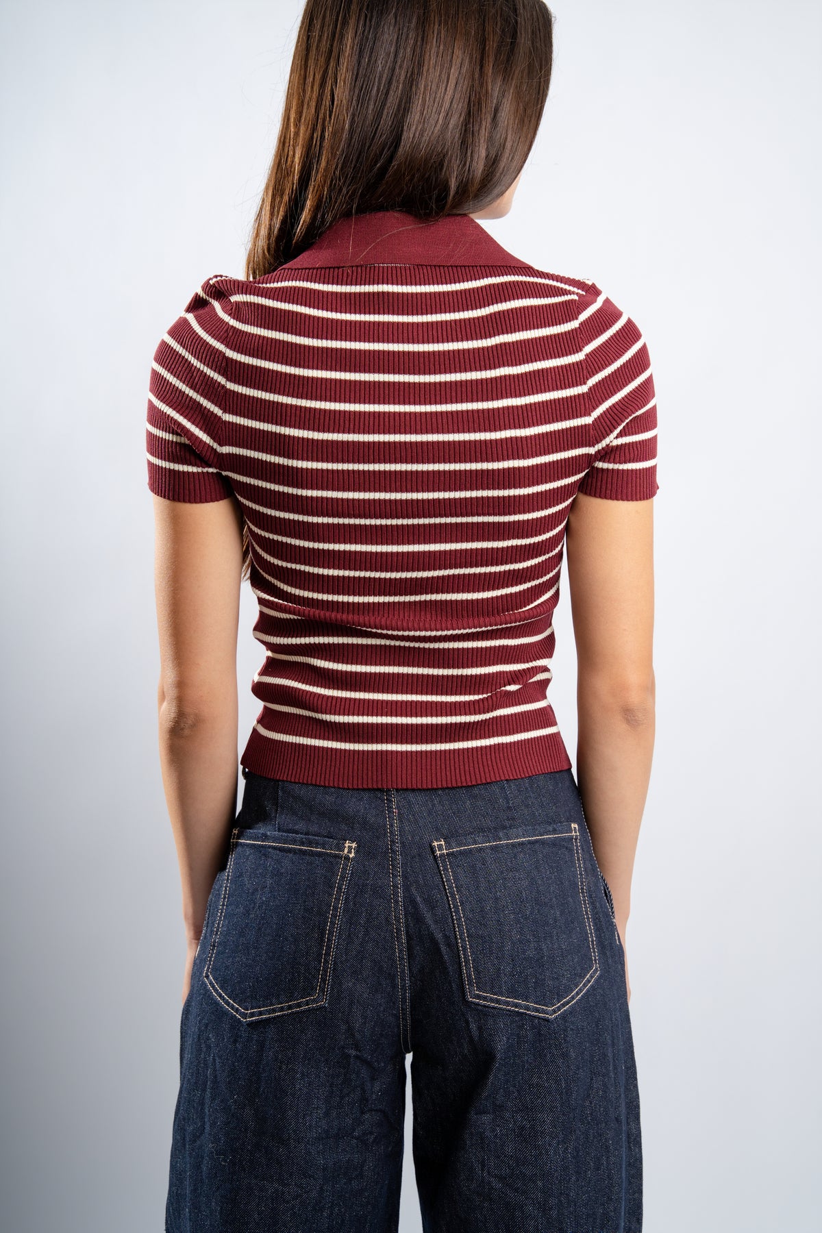 Polo rayé en maille bordeaux
